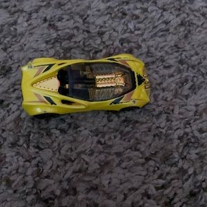 Yellow sports car hot wheel. Has a few chips in the paint.